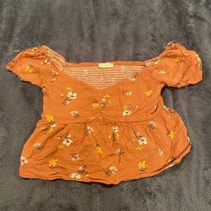 Pink flowy top with flowers on it